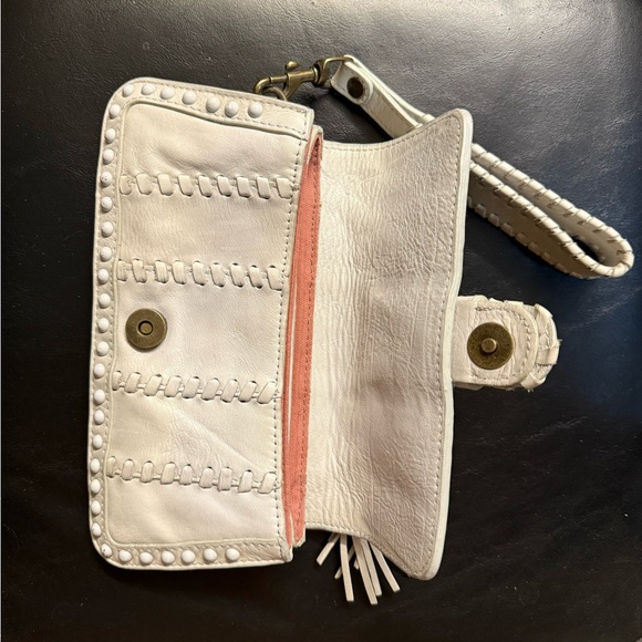 Isabella Fiore Cream Leather Clutch/wristlet with Tassel, Buckle, and studs - Picture 3 of 12